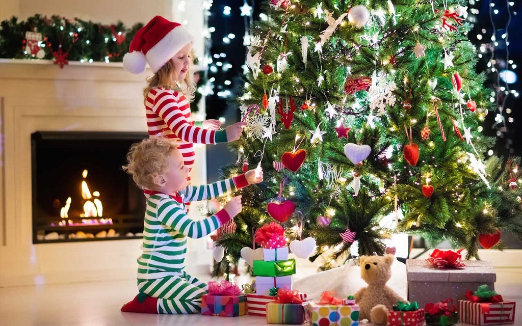 Kids Enjoy Decorating the Christmas Tree
